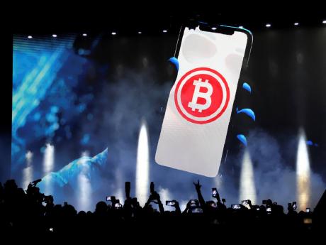 A bitcoin symbol is presented on an LED screen during the closing ceremony of a congress for cryptocurrency investors in Santa Maria Mizata, El Salvador, on November 20, 2021.
