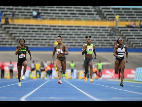 Credit: Gladstone Taylor Elaine Thompson Herah (second left) wins her semi-final heat at the JAAA National Senior and Junior Athletics Championships inside the National Stadium earlier this evening. Also in the frame are from left: Kemba Nelson, Shericka Jackson and Remona Burchel