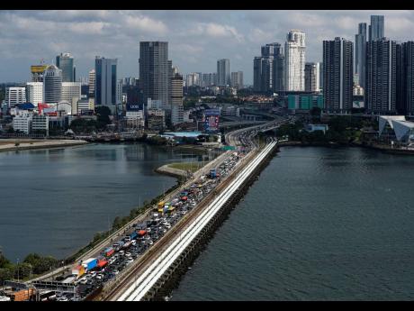 Credit: Reuters via ANI Johor–Singapore Causeway that links the city of Johor Bahru in Malaysia across the Straits of Johor to the district and town of Woodlands in Singapore.