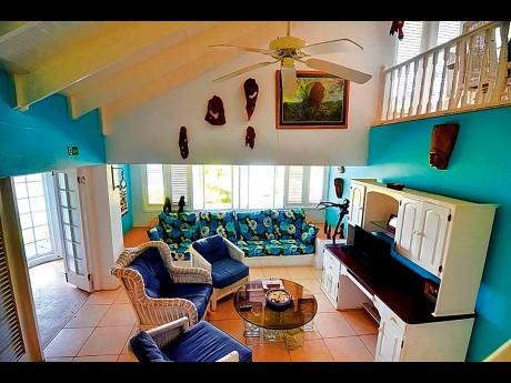 One of the relaxed colour-coordinated living areas.