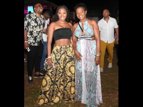 Danaé Reid (left) and Michelle Darling are chic and comfortable as they attend the fourth staging of the Jamaica Rum Festival. 