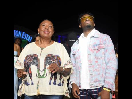 Minister of Culture, Gender, Entertainment and Sport Olivia ‘Babsy’ Grange (left) and recording artistes Omi enjoy the live performances. 