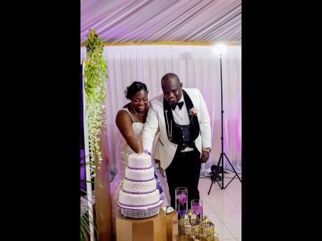 The bride and groom cut their beautiful wedding cake, made with love by Kempton’s mother, Audrey Sewell.