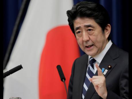 A 2013 photo of then Japanese Prime Minister Shinzo Abe while speaking at a news conference on Trans-Pacific Partnership or TPP at his official residence in Tokyo.