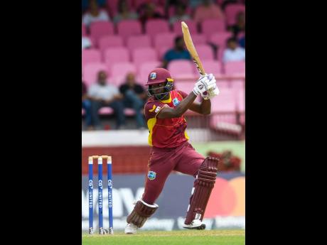 West Indies batsman Sharmarh Brooks hits a four during the   first One Day International match between the West Indies and Bangladesh at Guyana National Stadium in Providence, Guyana yesterday. 