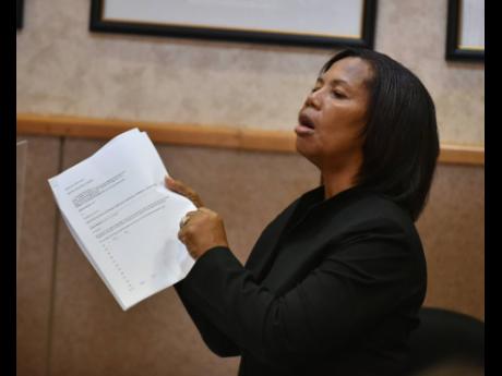 Councillor Jacqueline Lewis complains about dysfunctional street lights at Tuesday’s meeting of the Kingston and St Andrew Municipal Corporation.