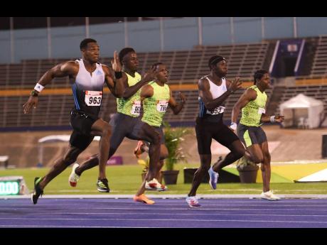 From left: Yohan Blake, Ackeem Blake, Nigel Ellis, Oblique Seville, and Conroy Jones compete in the 100-metre final at the JAAA National Senior and Junior Championships inside the National Stadium last month. 