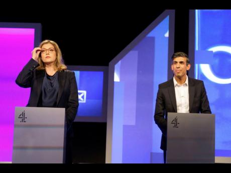 Credit: Victoria Jones Conservative party leadership contenders Penny Mordaunt and Rishi Sunak before the live television debate for the candidates for leadership of the Conservative party, hosted by Channel 4 in London, on Friday, July 15.