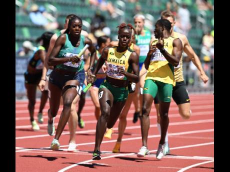 Jamaica’s Tiffany James-Rose on the final leg the 4x400m Mixed Relay round one. James-Rose received the baton from Karayme Bartley.