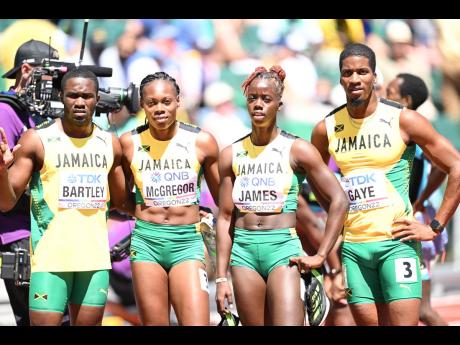 Members of Jamaica’s Mixed 4x400 metres team after competing in round one of the event. From left: Karayme Bartley, Roniesha McGregor, Tiffany James-Rose and Demish Gaye.