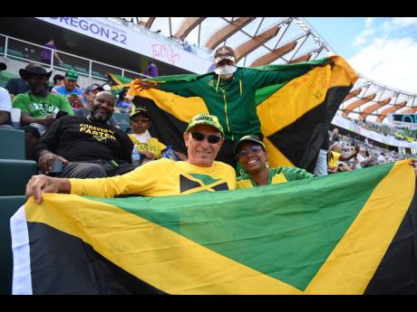 Fans celebrate the performances of Jamaicans at Hayward Field on day two of the World Athletics Championships in Eugene, Oregon.