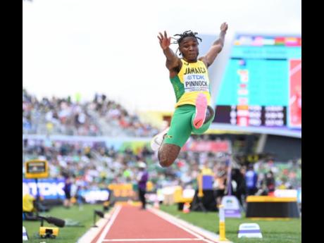 Jamaica’s Wayne Pinnock goes aerial during the final of the long jump at the World Athletics Championship at the Hayward Field in Eugene, Oregon. 