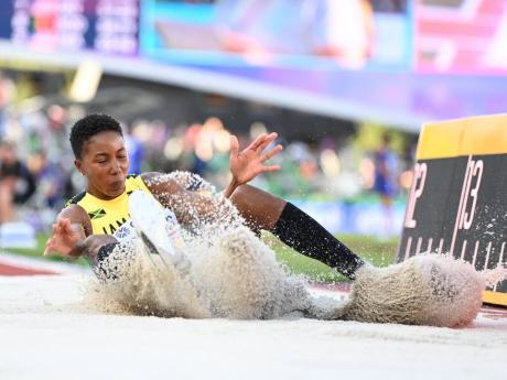 Credit: Gladstone Taylor/Multimedia Photo Editor Shanieka Ricketts leaps out to 14.89 metres on her first jump at the World Athletics Championships in Eugene, Oregon, on Monday.