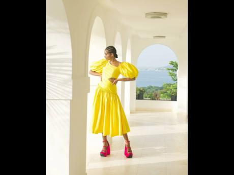 Credit: Wade Rhoden Shot by Jamaican photog Wade Rhoden for the British fashion glossy ‘Stylist’, Tash Ogeare is wearing an Aje chateau cutout midi dress, Missoma jewellery and Versace platform sandals.