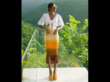 Credit: Wade Rhoden Portland-born beauty Tash Ogeare, winner of SAINT’s 2018 female Fashion Face of the Caribbean, in a Sandro midi skirt with fringed hemline, Guess eyelet top, Longchamp sunglasses and River Island clogs.