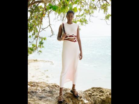 Credit: Wade Rhoden Cliffside at Destiny Villa in MoBay, Tash Ogeare wears a Christopher Esber dress, Vagabond Shoemakers sandals and a Mulberry bag.