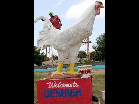 The welcome mascot at the Denbigh Show Ground gets a fresh coat of paint, as the preparations continue for this year’s 68th staging of the Denbihg Agricultural, Industrial and Food at the Denbigh show goround in May Pen, Clarendon.