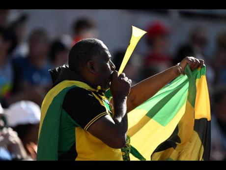 A Jamaican supporter makes his voice heard from the stands of the Hayward Field on day eight of the World Athletics Championships in Eugene, Oregon on Friday.