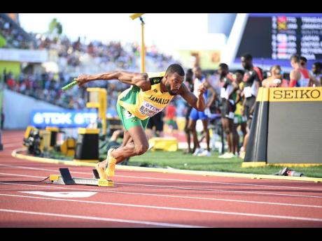 Ackeem Bloomfield leads Jamaica’s 4x400-metre team through qualification for the final of the World Athletics Championships at Hayward Field in Eugene, Oregon yesterday.