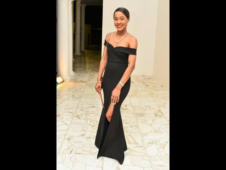 Digital Media Manager, Mayena B Rodríguez, made a statement with a chic off-the-shoulder black dress.