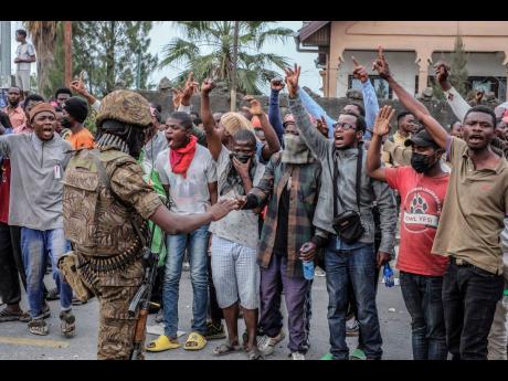 Residents protest against the United Nations peacekeeping force (MONUSCO) deployed in the Democratic Republic of the Congo, in Goma, yesterday. 