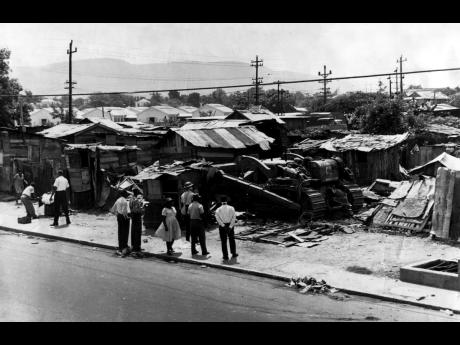 In this 1966 photo a bulldozer demolishes a squatter settlement. Sadly, the government continues to perpetuate the action of squatter removal of the poor in the absence of any housing provision for them.