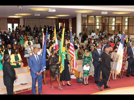 Credit: Contributed Flagbearers enter the sanctuary in Takoma Park, Maryland, signalling the commencement of the thanksgiving service to mark Jamaica’s diamond jubilee of Independence and 184 years of Emancipation. Leading the procession is Rick Nugent, president of the Jam