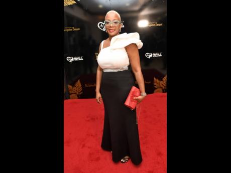 Credit: Rudolph Brown Nicole Ennis, head of medicines, quality control and survellance, Caribbean Public Health Agency, walked the red carpet in a classic black and ivory gown.