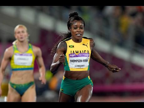Jamaica’s Elaine Thompson Herah crosses the finish line to win the gold medal in the women’s 200 metres during the athletics competition in the Alexander Stadium at the Commonwealth Games in Birmingham, England, yesterday.