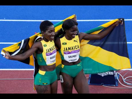 Credit: AP Photo
Gold medallist Janieve Russell (left) and silver medallist Shiann Salmon, both of Jamaica, celebrate at the end of the women’s 400-metre hurdles during the athletics competition in the Alexander Stadium at the Commonwealth Games in Birmingham, England y