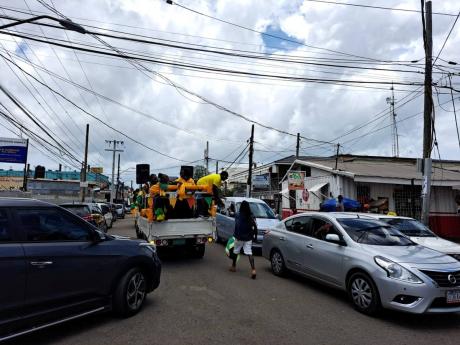 A truck decorated in Jamaica colours makes its way in Old Harbour as a part of 60th Independence Day celebrations.