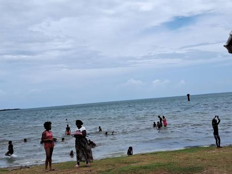 People enjoy Independence Day at Old Harbour beach.