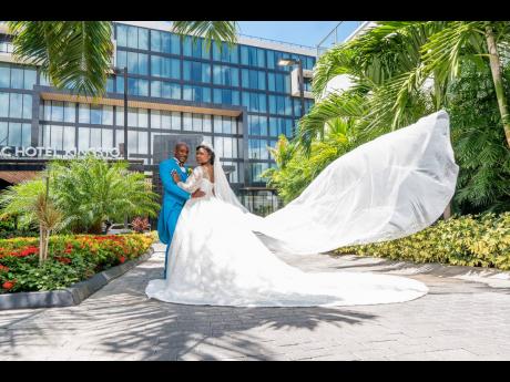 With Safari’s elevated veil  blowing in the wind, the duo make a dashing pair as they pose for wedding photos. 
