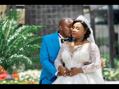 With a tender kiss, the newly-weds celebrate happily ever after.