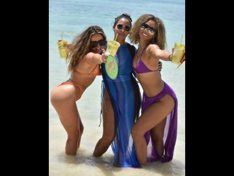 Credit: Kenyon Hemans From left : Millie Hope, Zoe Dawkins and Rikki Spencer were enjoying the early vibes of the party.