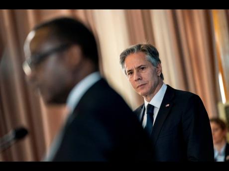 US Secretary of State Antony Blinken listens as Rwanda’s Minister of Foreign Affairs Vincent Biruta speaks during a news conference at the Ministry of Foreign Affairs and International Cooperation in Kigali, Rwanda, on Thursday, August 11. 