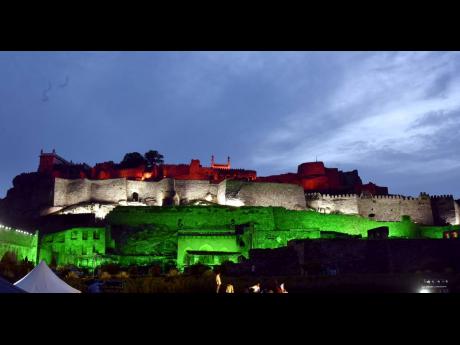 Historic Golconda fort near the the southern Indian city of Hyderabad is illuminated with tricolour lighting