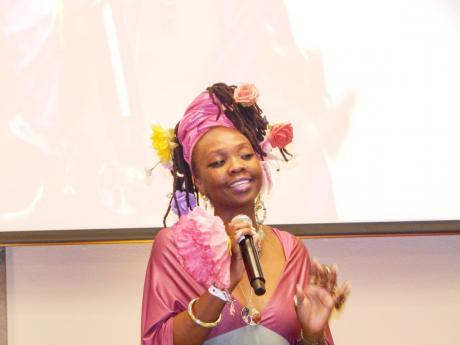 Credit: Michael Reckord Ebony Payne recites one of her poems about racial pride.