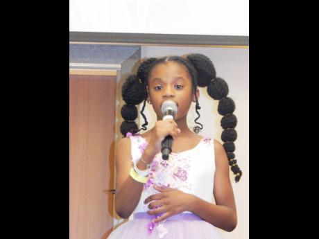 Credit: Michael Reckord Jazmin Headley, a nine-year-old Canadian singer, writer and actress of Jamaican parentage makes her debut on the Jamaica Poetry Festival stage.