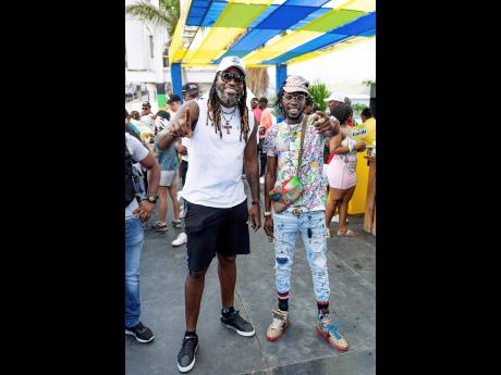 Credit: Contributed West Indies bastsman Chris Gayle (left) and artiste Junior ‘Tanto Blacks’ Henry were giving ‘real rich’ vibes while out for cricket.