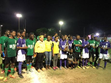Manning Cup players from Kingston College (KC) and Calabar High School converge after the 2019 David ‘Wagga’ Hunt Football Classic.