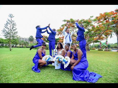 Credit: Contributed Right: The groom and his groomsmen share a spirited high five while the bride and her bridesmaids remain elegant in full support.