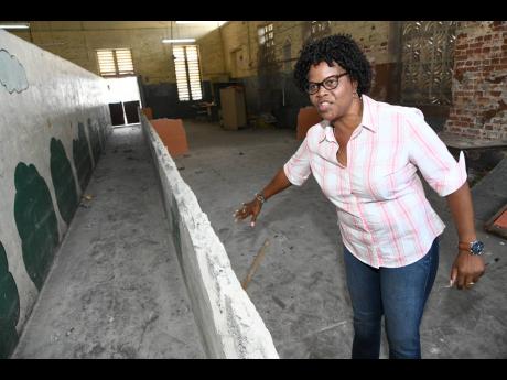 Credit: Rudolph Brown/Photographer Joset Leslie, principal of Calabar Primary School, shows the space being reconfigured as a multifunctional room, where students will be able to do homework, watch educational programmes, and engage in art and craft and other activities.