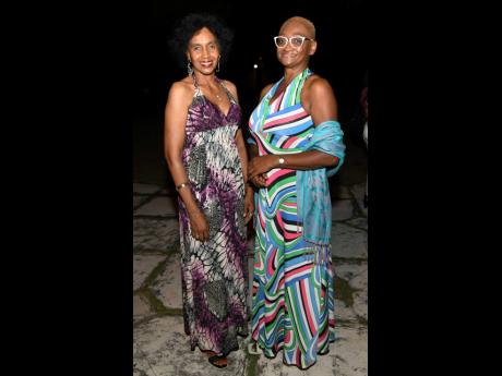 Credit: Rudolph Brown left: Jacqueline Gayle (left) and Evadney Ramdial were chic and elegant in floor length dresses.