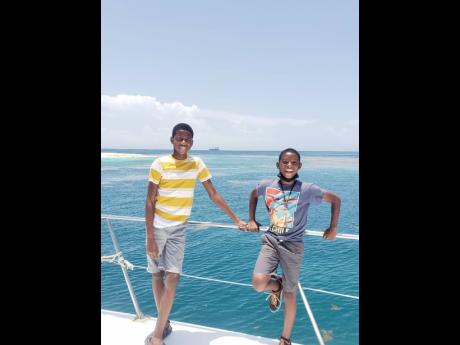 William Kelly (left) and Joshua Thombs were among the children who participated in the boat tour organised by Oceans for Everyone Inc.