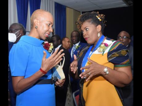 Credit: Ashley Anguin Education Minister Fayval Williams (left), converses with newly-installed Jamaica Teachers’ Association (JTA) President La Sonja Harrison on Monday during the JTA’s 58th annual conference at the Hilton Rose Hall Resort and Spa in Montego Bay, St James.