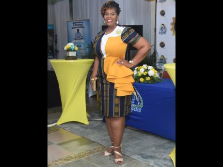 Credit: Ashley Anguin La Sonja Harrison pauses for a smile during the Jamaica Teachers’ Association 58th annual conference.
