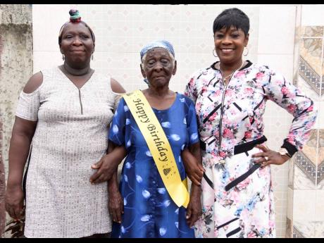 Lisa Brown (left), daughter of centenarian Viola Brown (centre), and granddaughter Lavern Brown. They will celebrate Viola’s 100th birthday today in Arnett Gardens, southwestern St Andrew. 