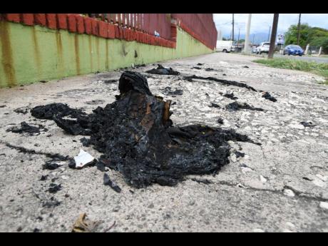 Credit: Rudolph Brown/Photographer The spot where Linton Johnson, a homeless man, was found on fire at western Heroes Circle in Kingston on Monday. He was pronounced dead at hospital.