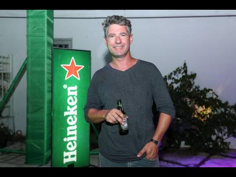 Ryan Grala, founder and managing director at Sea Island Beach Club in Montego Bay, enjoyed a drink at the Heineken After-work pop-up event. 